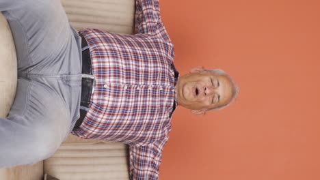 Vertical-video-of-Relaxed-man-happy-and-peaceful.